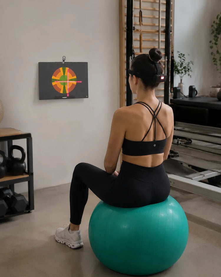 HeadX Kross used with a visual target for cervical motor-control training.